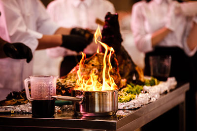 Burning candles on barbecue grill