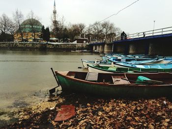 Boats moored in river