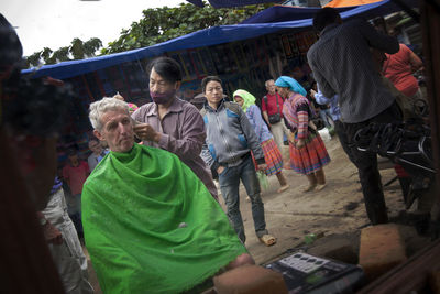 Group of people at market stall