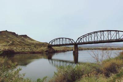 Bridge over river against sky