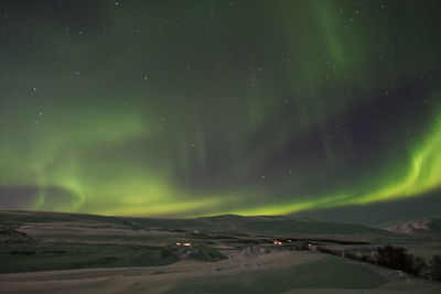 Green sky due to aurora borealis near akureyri