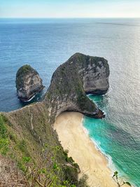 High angle view of rocks on sea shore