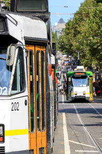 Close-up of trams in city