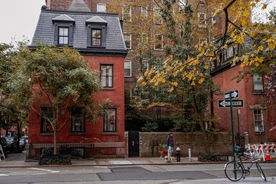 Road by building in city during autumn