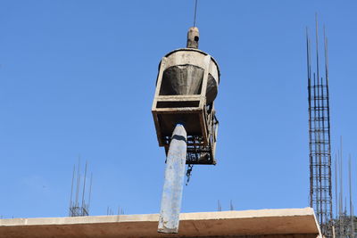 Low angle view of built structure against clear blue sky