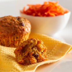 Appetizing carrot muffins on a white background. trendy food, eco-friendly home baking.