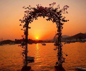 Scenic view of sea against orange sky