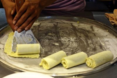 Close-up of man preparing food