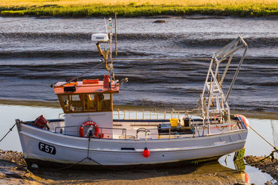 Boat moored on shore