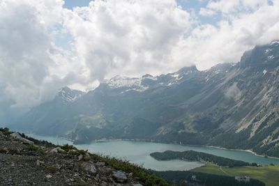 Scenic view of lake surrounded by mountains