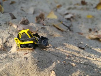 High angle view of toy car on sand