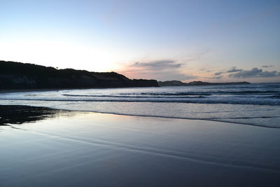 Scenic view of sea against sky at sunset