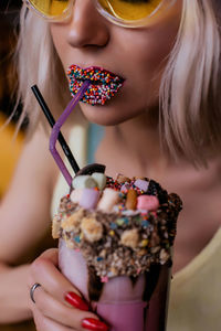 Midsection of woman having dessert