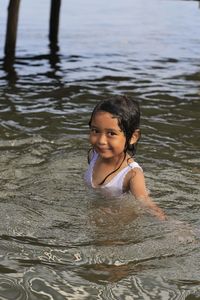 Portrait of smiling girl in water