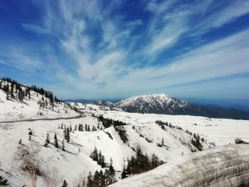 Scenic view of snowcapped mountains against sky