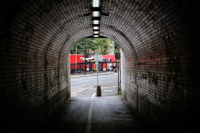 People walking in tunnel