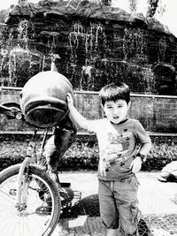 Portrait of boy riding bicycle
