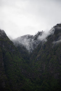 Scenic view of mountains against sky. wintery ambience. mysterious. 