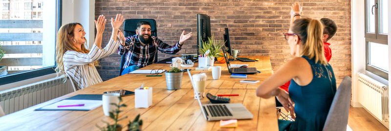 Businesspeople celebrating a success in office