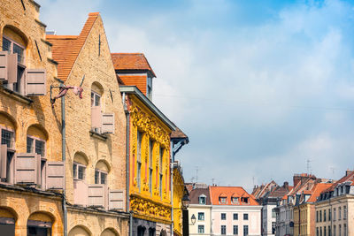 Houses in city against sky