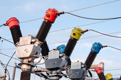 Low angle view of telephone pole against sky