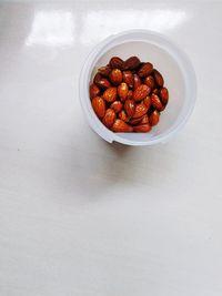 High angle view of strawberries in bowl on table