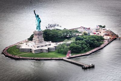 Statue of liberty amidst hudson river