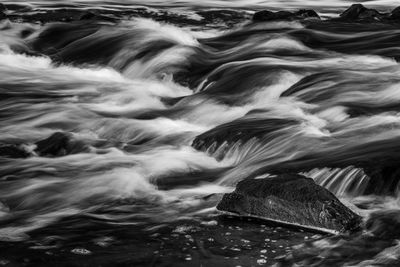 Blurred motion of rocks in sea