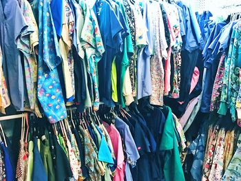 Full frame shot of multi colored umbrellas hanging at market stall