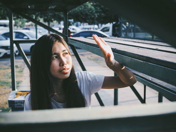 Portrait of young woman looking away