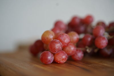 Close-up of grapes on table