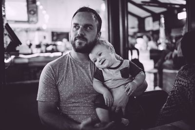 Full length of father and son in restaurant