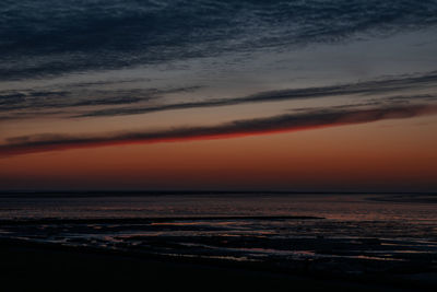 Scenic view of sea against romantic sky at sunset