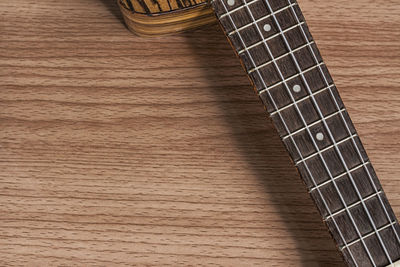 High angle view of guitar on table