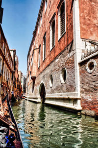 Canal passing through city buildings