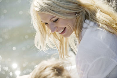 Happy mid adult woman looking away