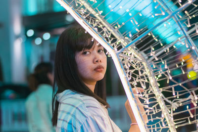 Portrait of young woman looking away