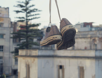 Close-up of clothes hanging against built structure