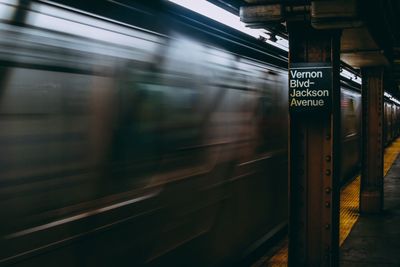 Blurred motion of train at railroad station