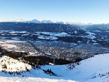 Close-up of snow covered landscape against clear sky