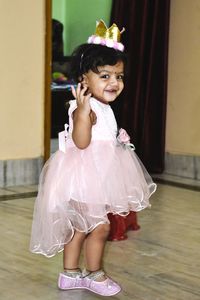 Cute girl standing at home