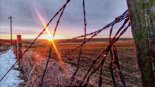 View of swing at sunset