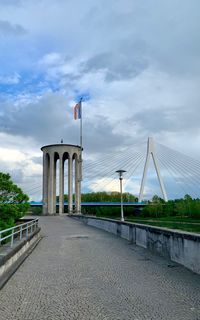 View of bridge against cloudy sky