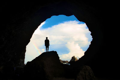 Silhouette man walking on mountain