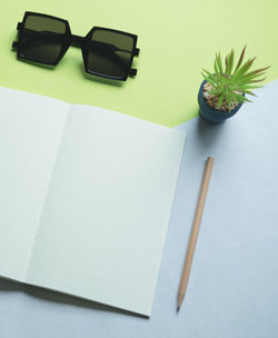 High angle view of pencils on table against white background