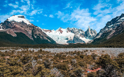 Scenic view of snowcapped mountains against sky