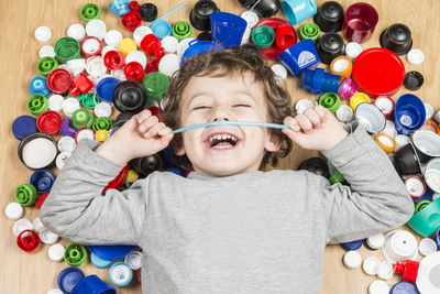 Portrait of cute boy holding toy