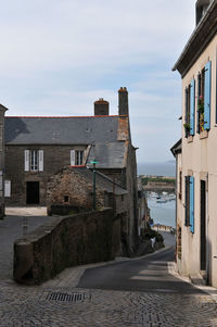 View of buildings against cloudy sky