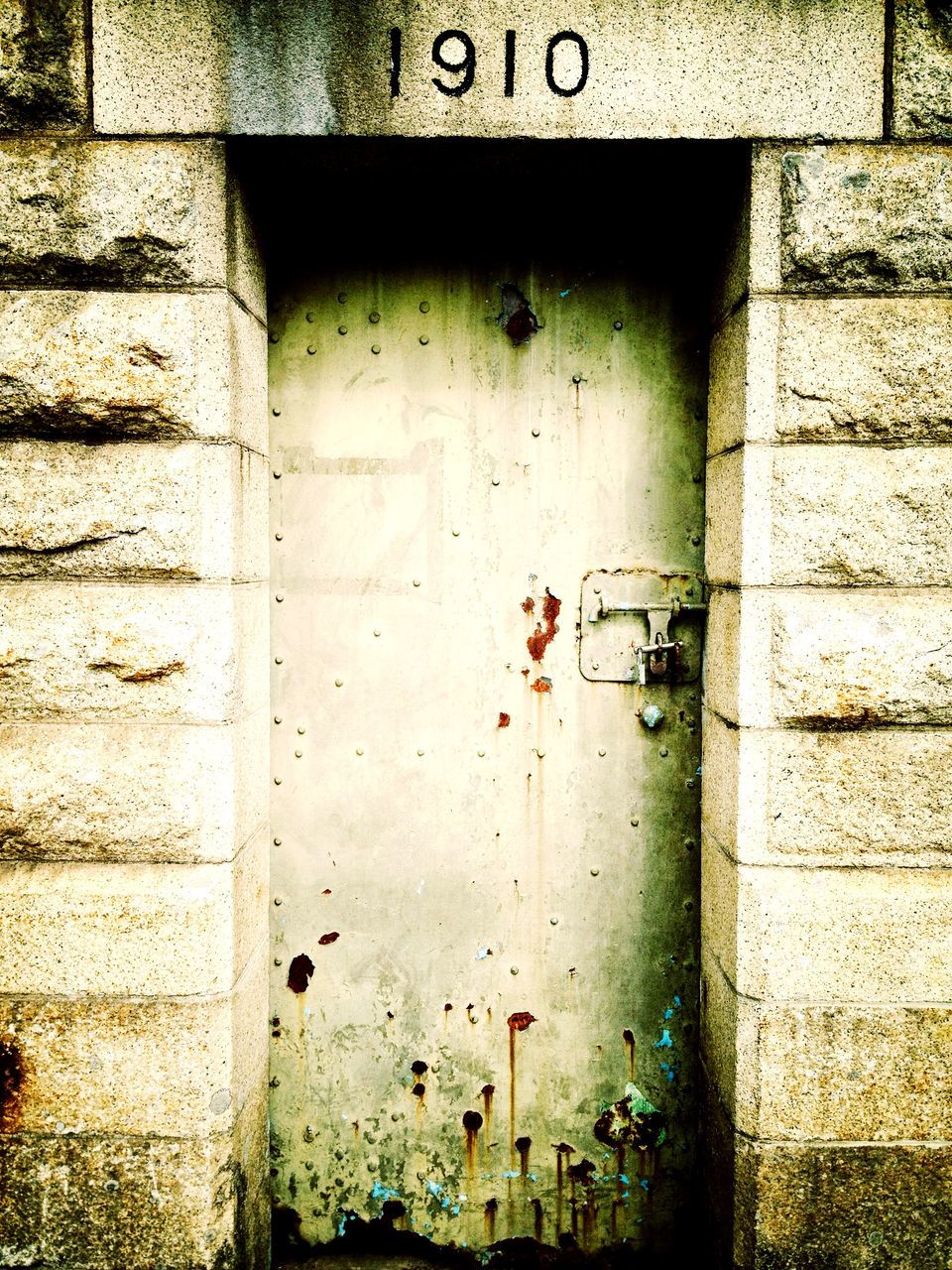 architecture, built structure, wall - building feature, building exterior, weathered, brick wall, old, wall, door, damaged, deterioration, closed, abandoned, day, house, close-up, outdoors, plant, no people, protection