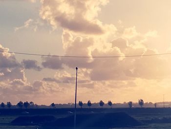 Silhouette city against sky during sunset